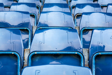 Fototapeta premium blue empty seat grandstand in the soccer stadium background.