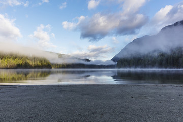 Morning at the lake. Forest reflection. Forest fog. Blue sky. Cloudy morning. Forest and mountain. Vancouver nature. Pacific North West. Nature. Nature park. Early morning. Sunrise. 