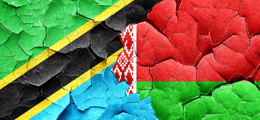 Tanzanian flag with Belarus flag on a grunge cracked wall