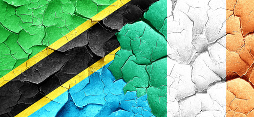 Tanzanian flag with Ireland flag on a grunge cracked wall
