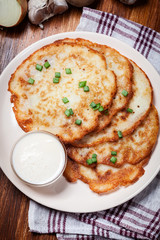 Potato pancakes with sour cream