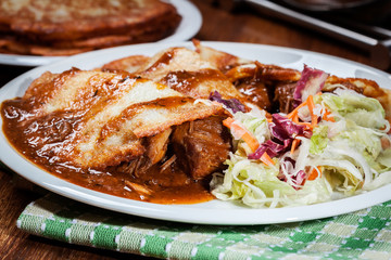 Potato pancakes with meat stew served