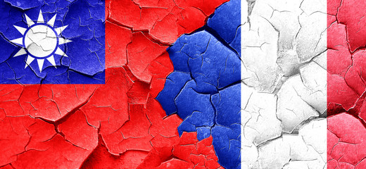 Taiwan flag with France flag on a grunge cracked wall