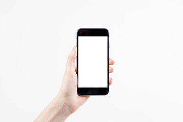 Hand holding mobile smart phone with blank screen