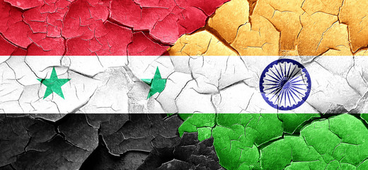 Syria flag with India flag on a grunge cracked wall