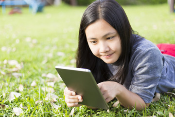 Woman Use Tablet for Relaxation at Playground