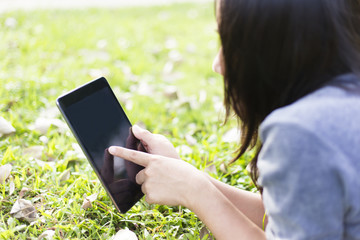 Woman Use Tablet for Relaxation at Playground