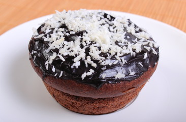 Fresh baked chocolate muffins with desiccated coconut