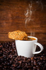 Cup of coffee with whole grains cookies