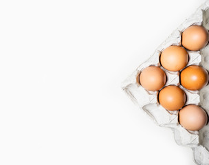 Top view of brown chicken eggs
