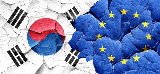 South korea flag with european union flag on a grunge cracked wa