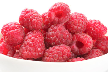 Raspberries close-up on white