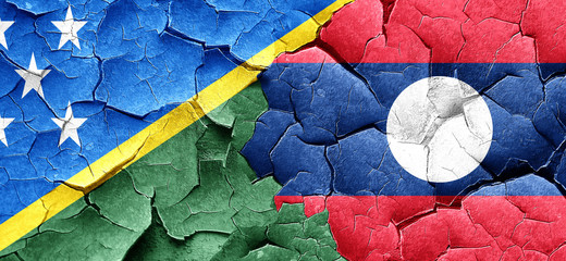 Solomon islands flag with Laos flag on a grunge cracked wall