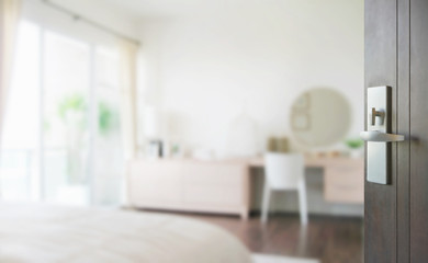 opened wooden door to modern bedroom interior as background