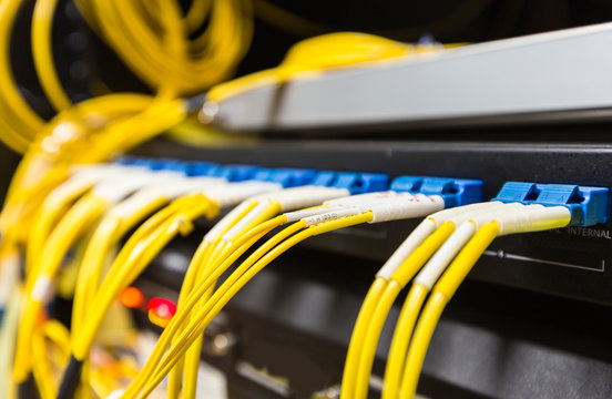 Fiber optic cable connect to network switch in data center..