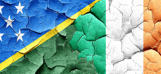 Solomon islands flag with Ireland flag on a grunge cracked wall