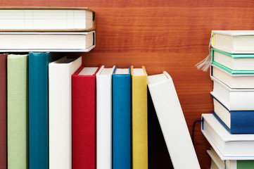 Books. Close up of bookshelf.
Colorful books. Wood grain background.
