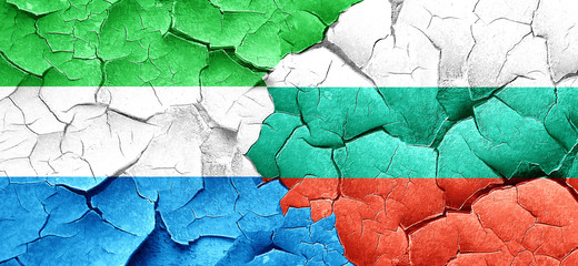 Sierra Leone flag with Bulgaria flag on a grunge cracked wall