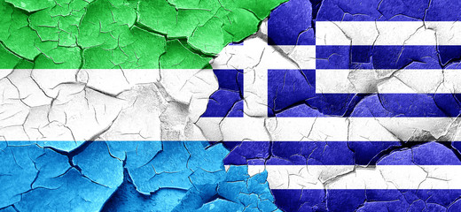 Sierra Leone flag with Greece flag on a grunge cracked wall