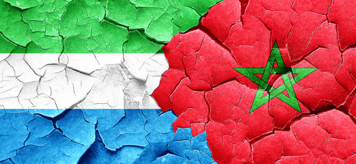 Sierra Leone flag with Morocco flag on a grunge cracked wall
