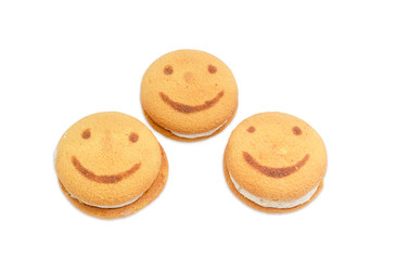 Three flaky cookies with the image of smiling face