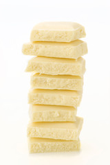 stack chocolate pieces in equilibrium; on white