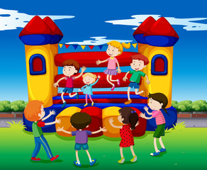 Obraz na płótnie Canvas Kids bouncing on the playhouse