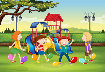 Obraz na płótnie Canvas Children playing balloon popping in the park
