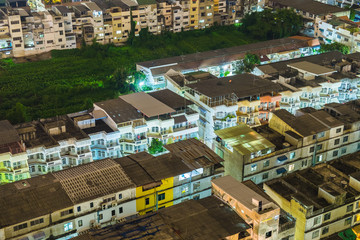 Fototapeta premium House village warren crowded light neon in capital at night scene