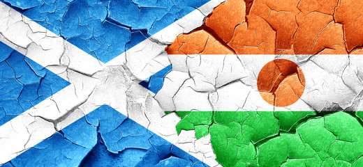 scotland flag with Niger flag on a grunge cracked wall