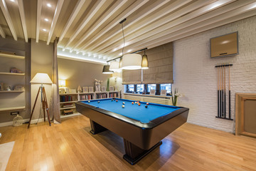 Interior of a luxury living room with billiard table - obrazy, fototapety, plakaty