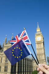 Fototapeta na wymiar European Union and British Union Jack flag flying in front of Big Ben and the Houses of Parliament at Westminster Palace, London, in preparation for the Brexit EU referendum