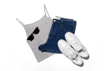 Outfit of casual woman. Top view of clothing and accessory