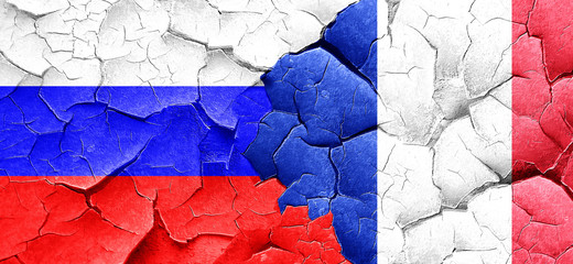 Russia flag with France flag on a grunge cracked wall