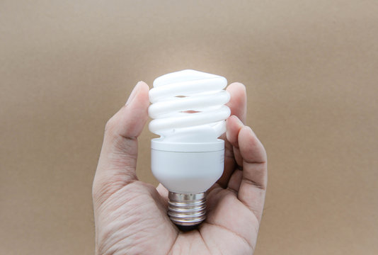 Compact Fluorescent Lamps with lighting on human hand