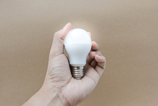 LED Bulb with lighting on humanhand
