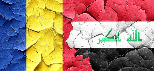 Romania flag with Iraq flag on a grunge cracked wall