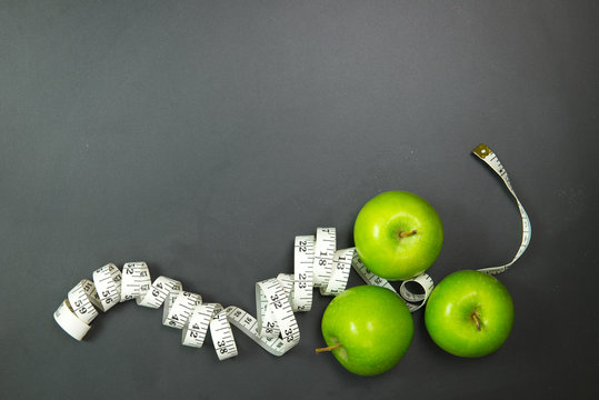 Dieting concept using green apples