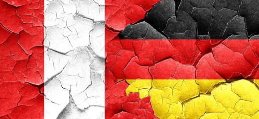 Peru flag with Germany flag on a grunge cracked wall