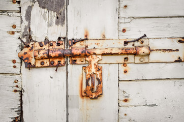 Close up of rusted keyhole on white wooden door (keyhole, rusted, door)