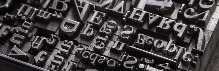 Metal Letterpress Types.
A background from many historic typographical letters in black and white with white background.
