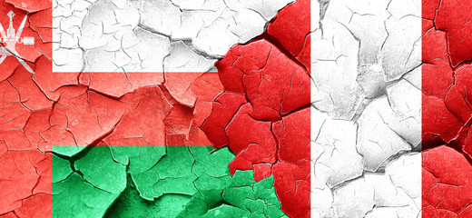 Oman flag with Peru flag on a grunge cracked wall