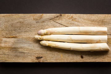 White asparagus on a wooden background