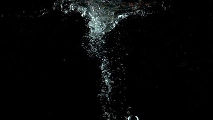 Red and green apple falling in water against black background. Super slow motion - Powered by Adobe