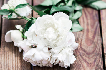 bouquet of peony white on wooden old rustic background. the concept of a wedding bouquet