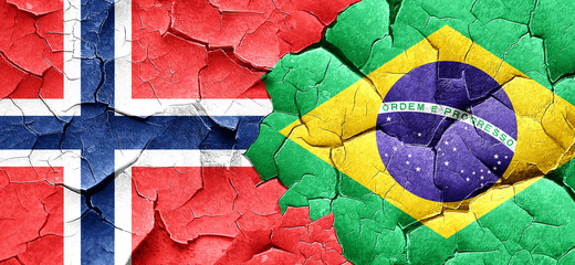 norway flag with Brazil flag on a grunge cracked wall