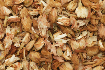 Organic dry Jasmine tea (Jasminum officinale) leaves. Macro close up background texture. Top view.