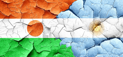 niger flag with Argentine flag on a grunge cracked wall