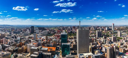Fototapeten Johannesburg city and the northern suburbs in the far distance. © dougholder