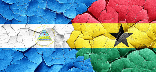 nicaragua flag with Ghana flag on a grunge cracked wall